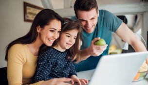 Picture of an immigrant family using their laptop
